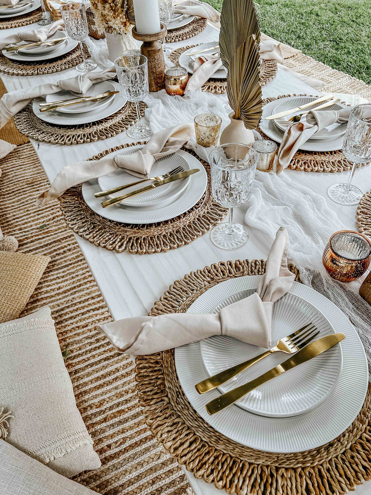 Natural boho picnic set up - close up of table settings