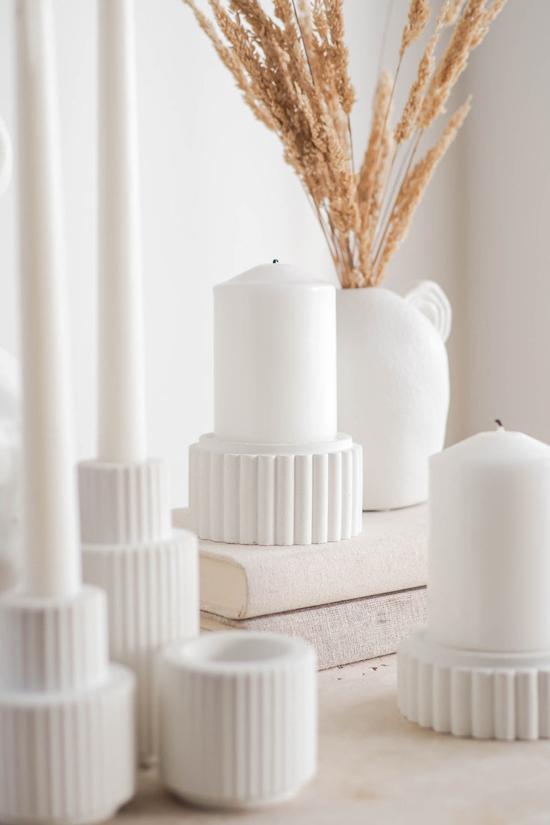 Preston candle holders displayed with our Palmer candle holders on a travertine table