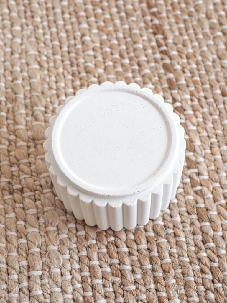 Detailed photo of Preston candle holders showing the materials irregularities and the scalloped edge texture