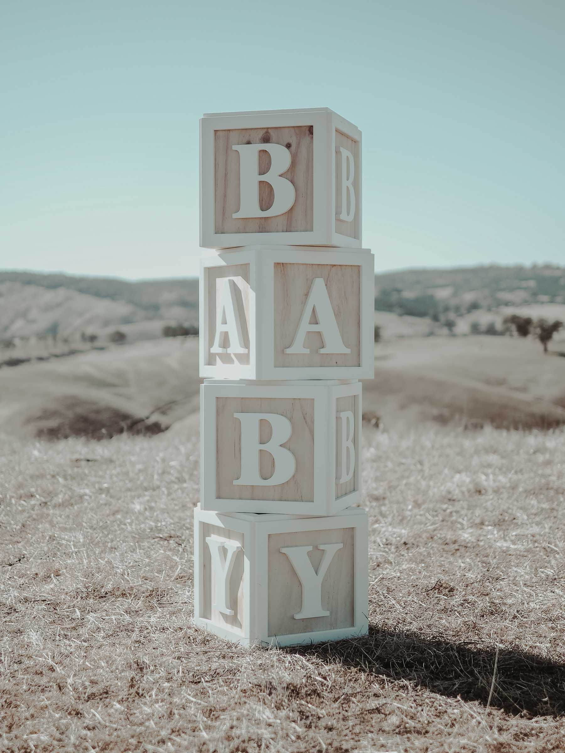 White and wood baby blocks for hire for a baby shower or baby's birthday