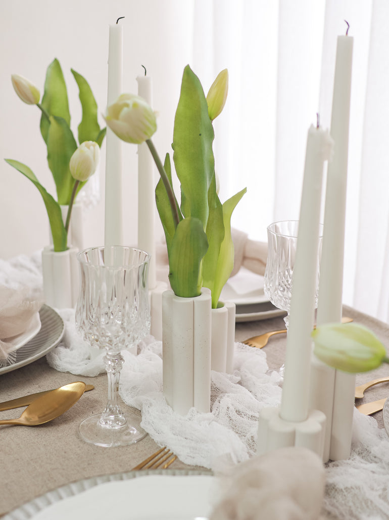 Palomino vases on a wedding table with white tulips
