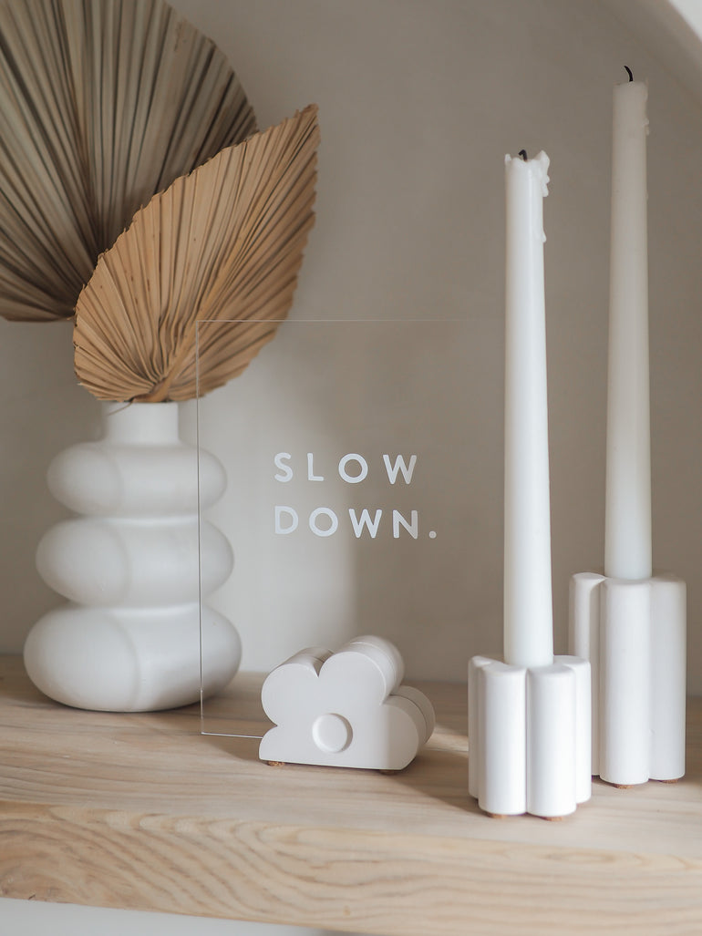 Willow candle holder pair with our Elm sign holder with a sign that reads 'slow down.'