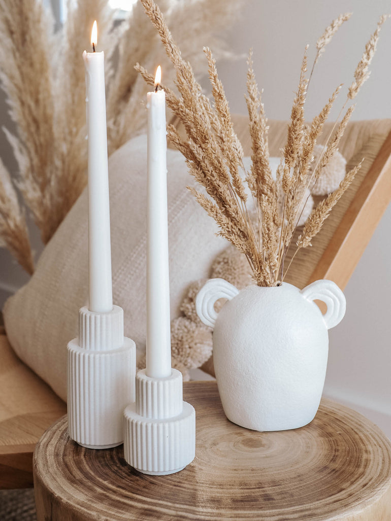 Palmer large and medium candle holders displayed with a boho vase filled with pampas