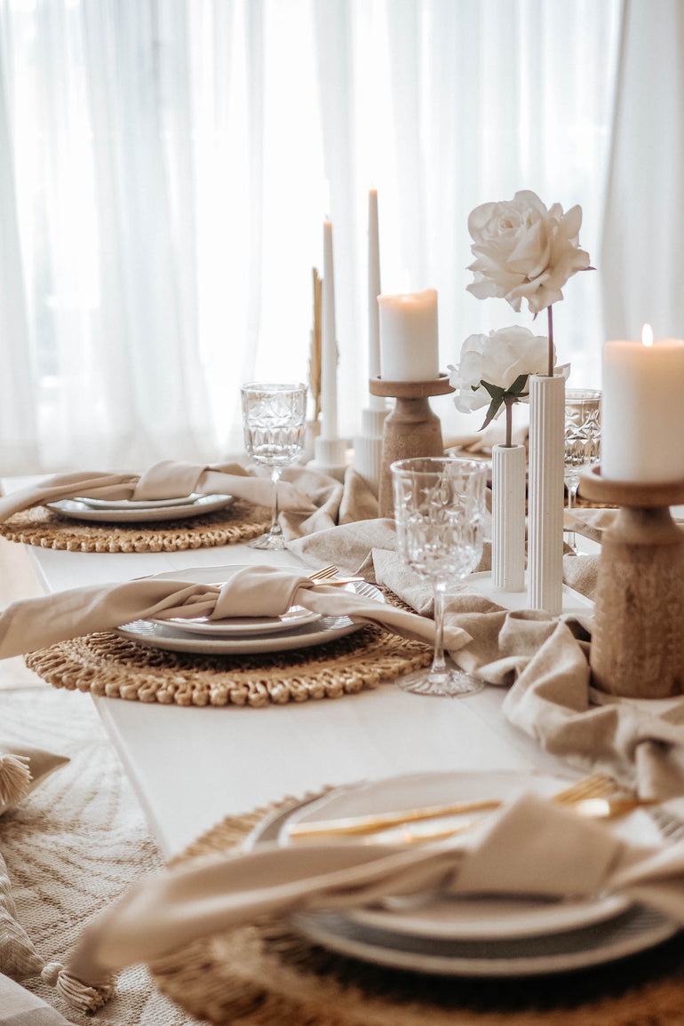 Taupe picnic set up with Sterling vase, palmer candle holders, wooden tall candle holders and jute placemats
